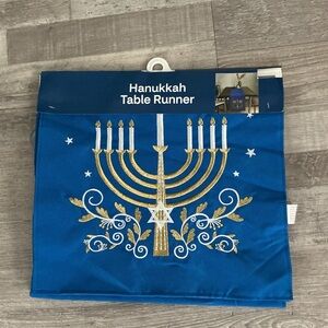 Blue Hanukkah table runner with gold menorah and Star of David